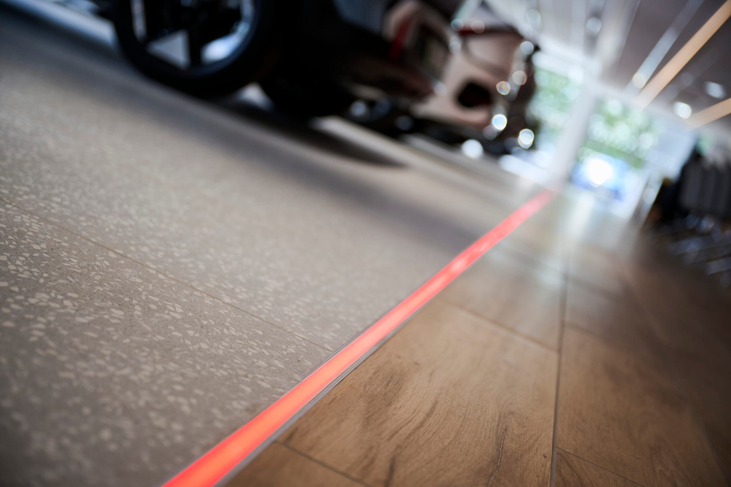 red LED lighting strip within floor