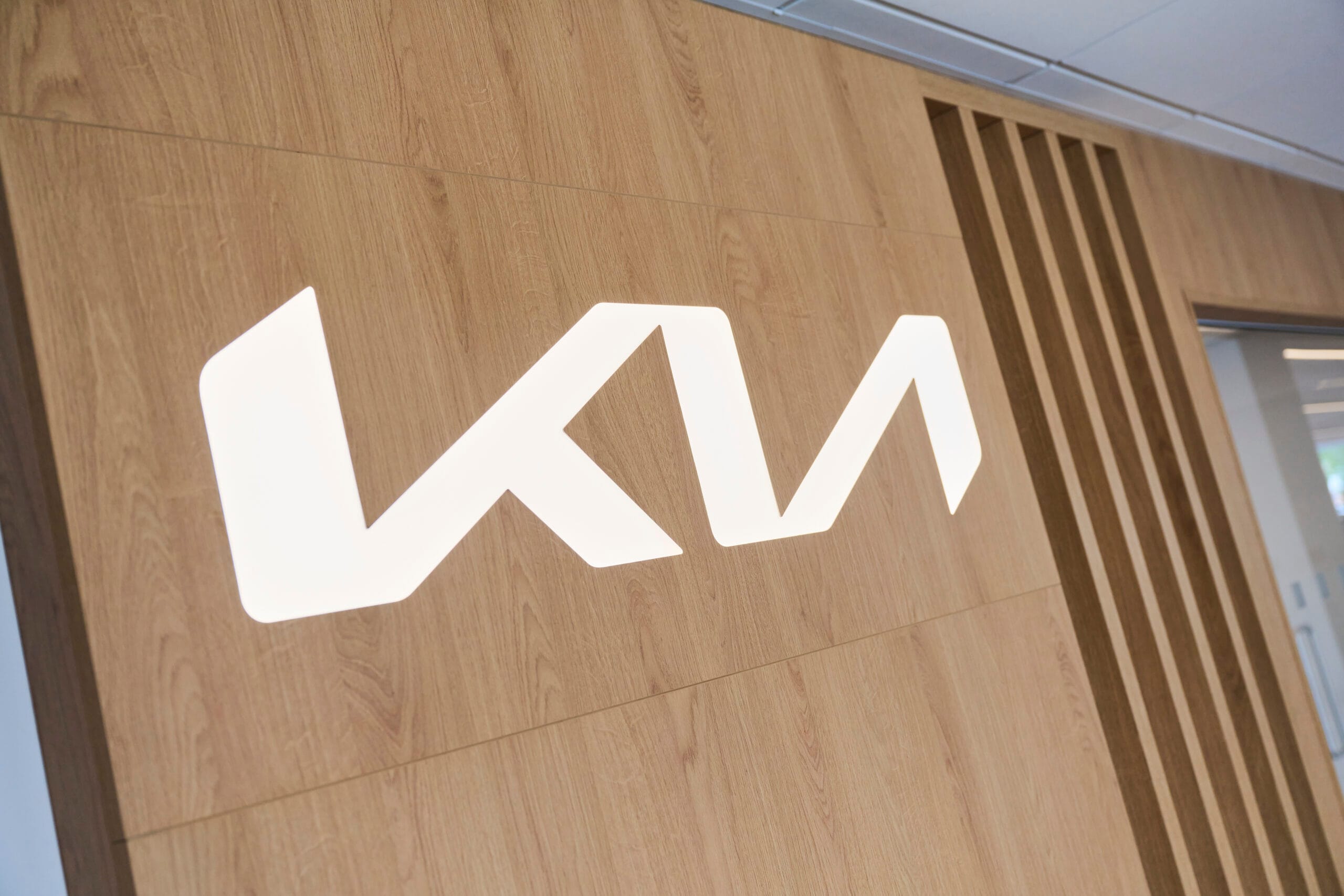 kia logo on timber background
