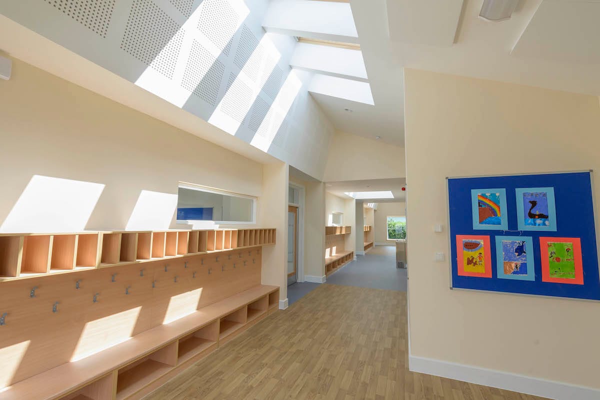 Bright school hallway with children's artwork on display.