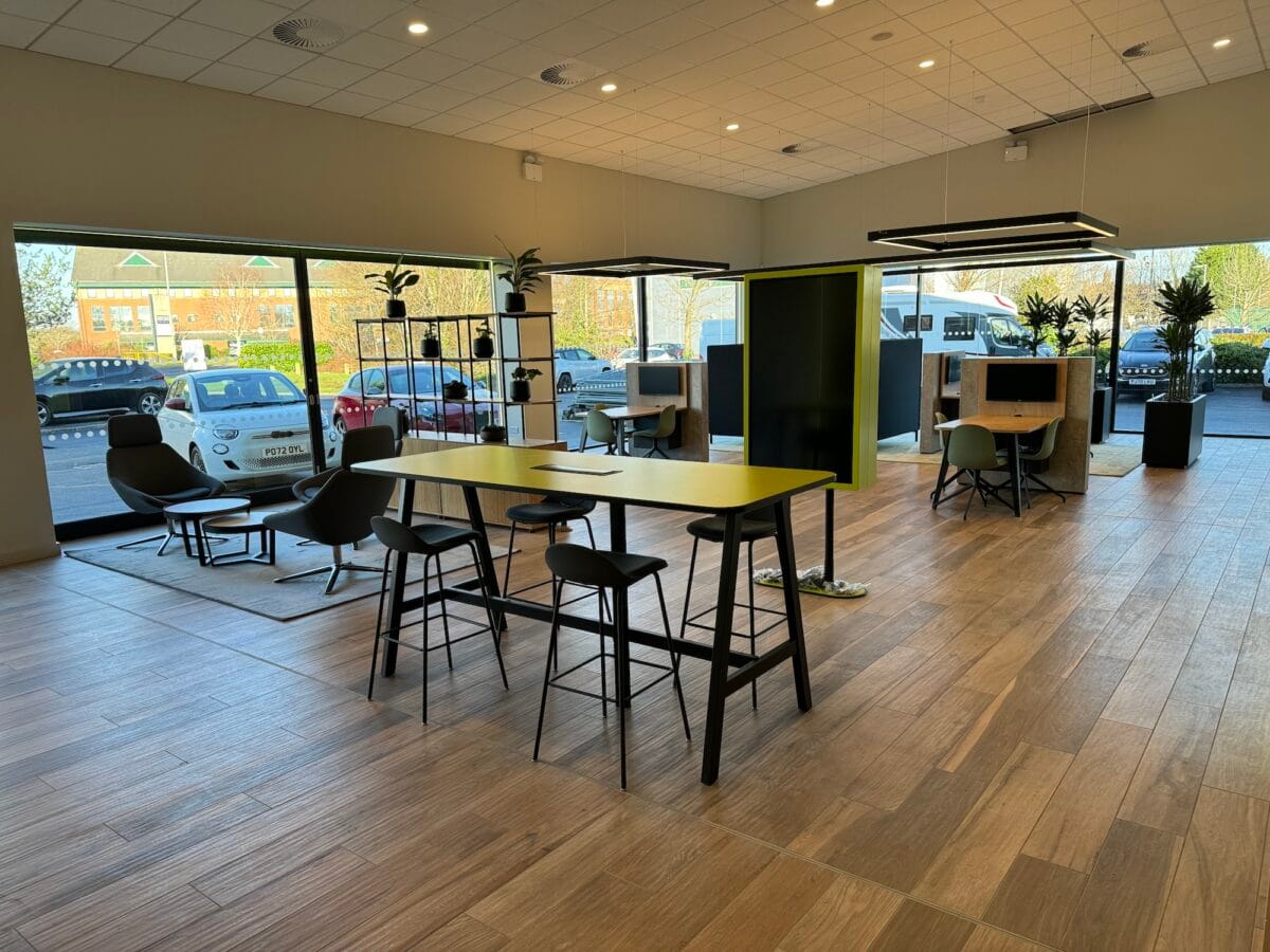 Modern office space with seating and tables.
