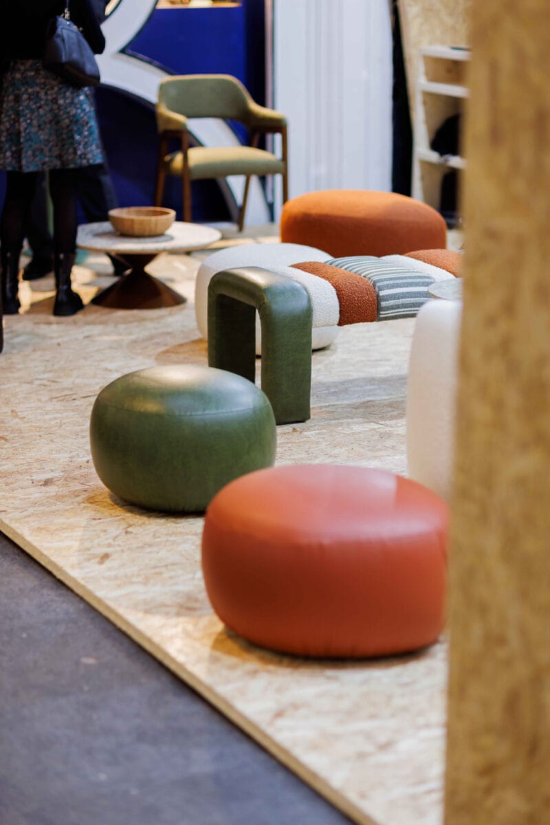 Modern furniture display with colourful pouffes and chairs.