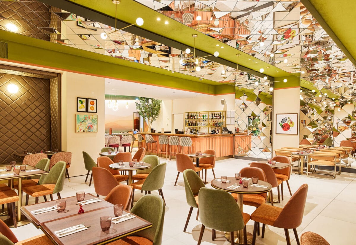 Modern restaurant interior with bar and colourful seating