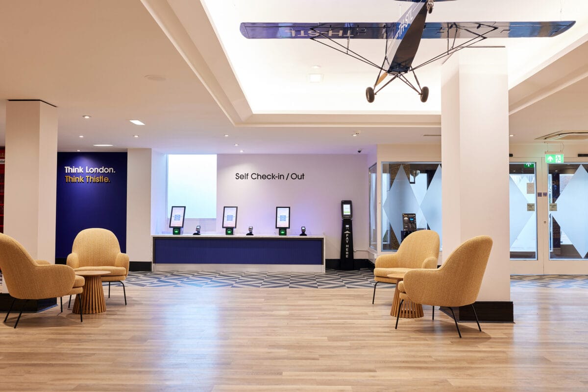 Modern hotel lobby with self check-in kiosks
