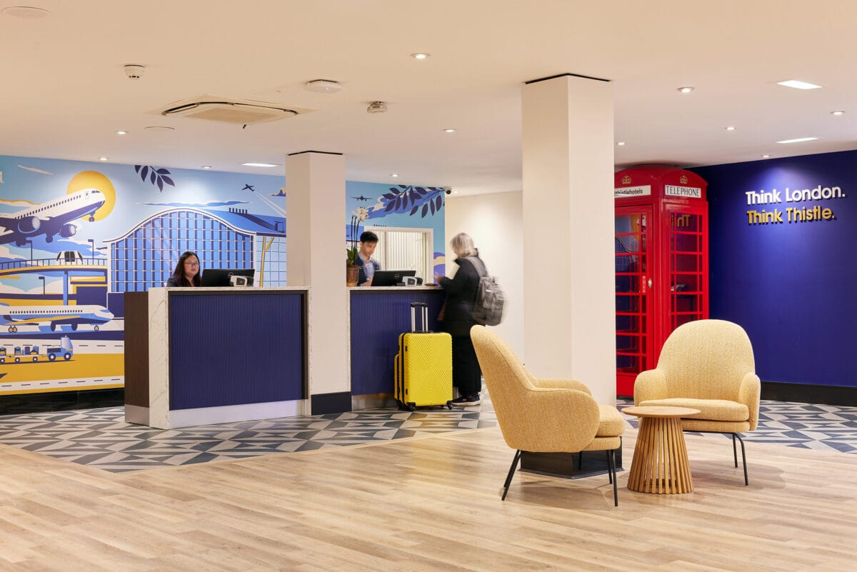 Modern hotel reception with London-themed decor