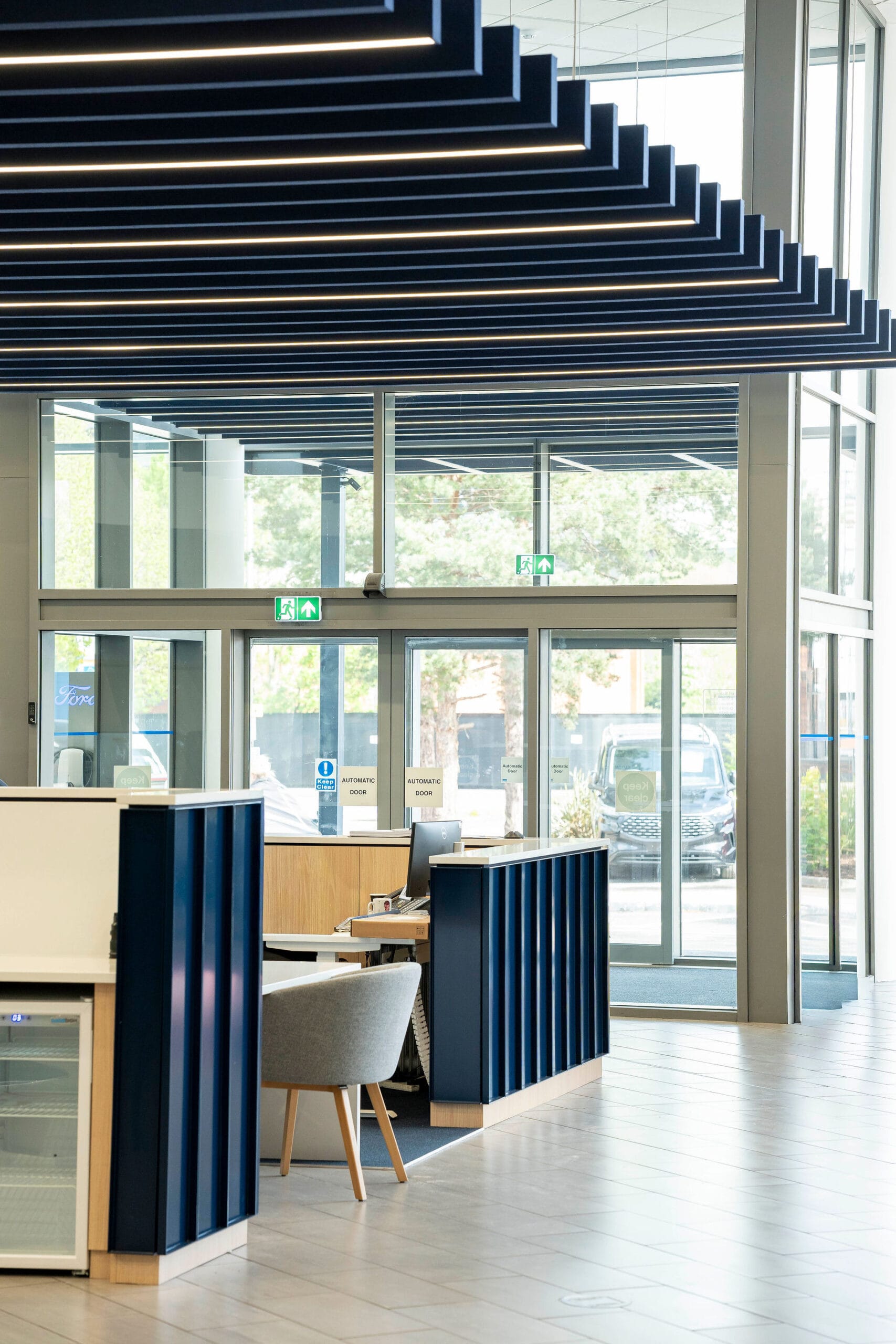 Modern office reception with glass automatic doors