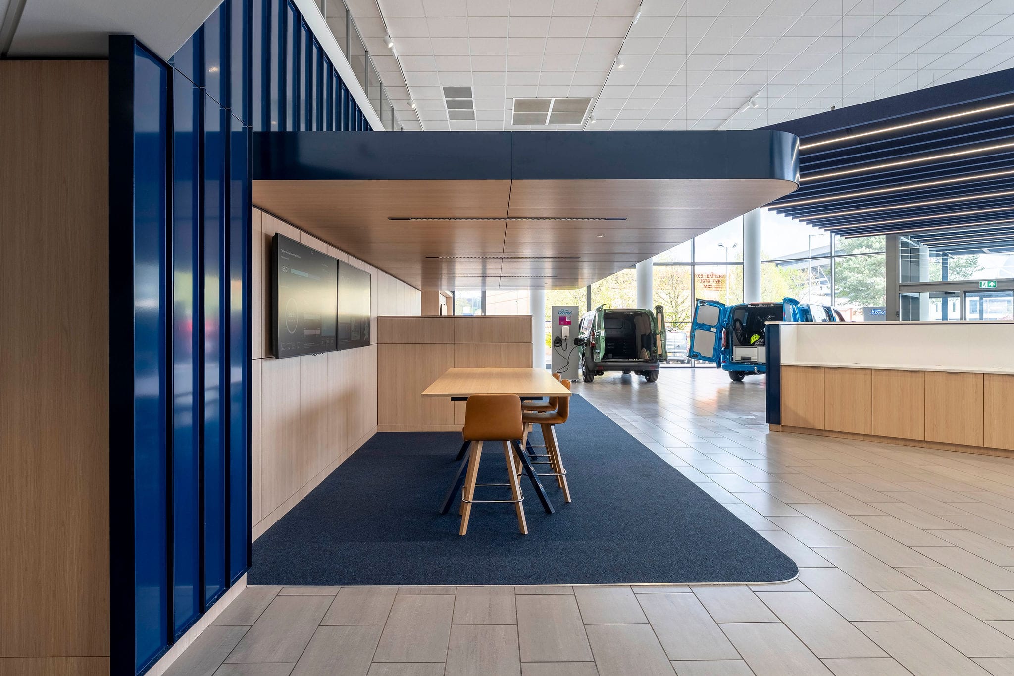 Modern car showroom interior with display vans