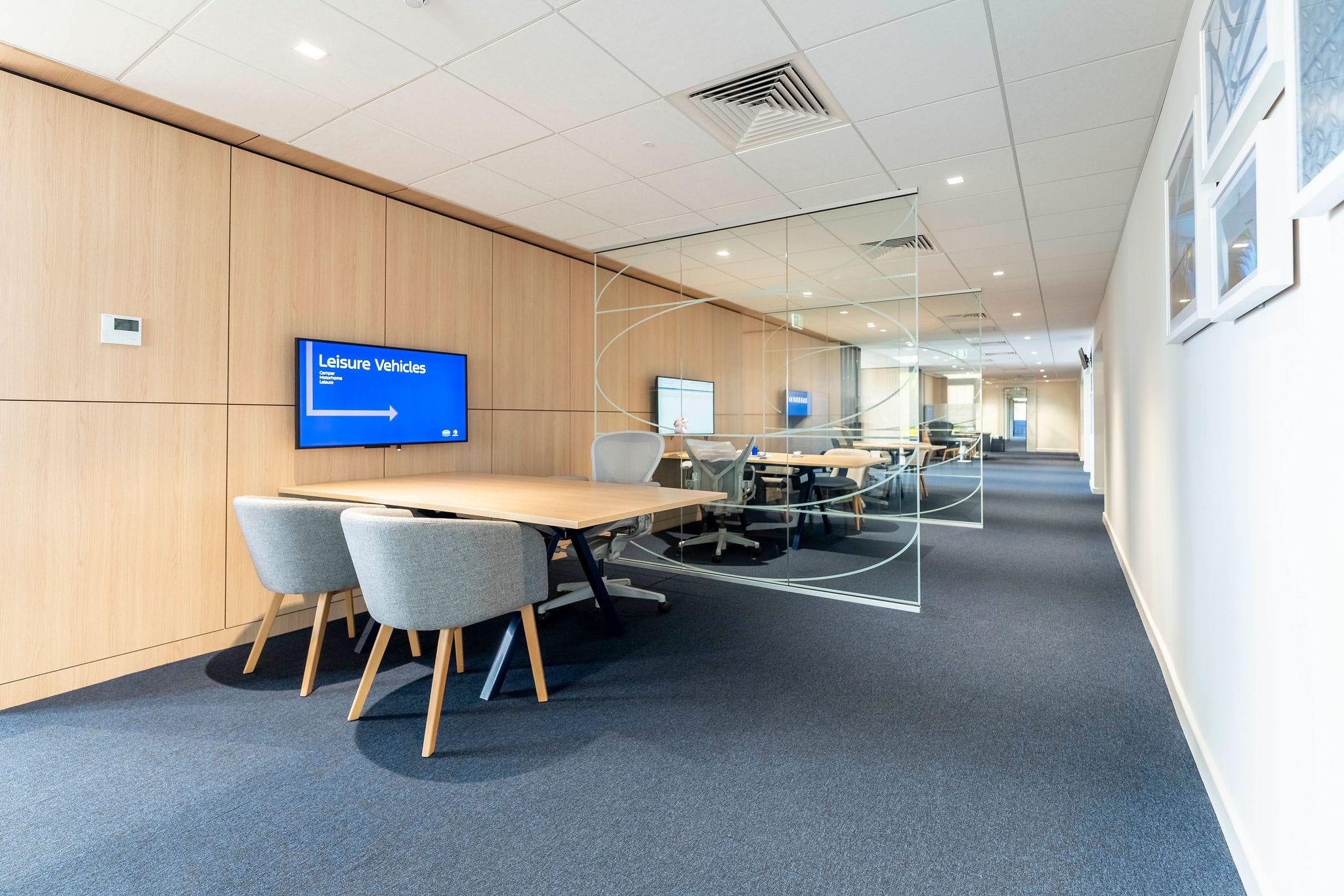 Modern office interior with desks and glass partition